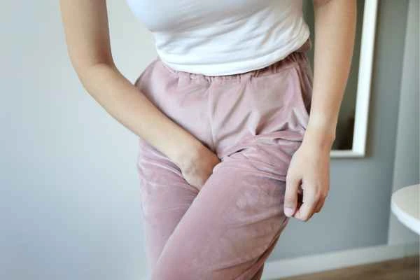 woman struggling with urine incontinence Kings Langley